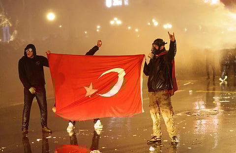 Protesters during clashes with Turkish anti-riot police in support of Istanbul mayor.