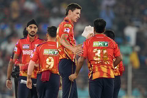 Marco Jansen of Punjab Kings celebrates the wicket of Jos Buttler of Gujarat Titans in Ahmedabad on Tuesday.