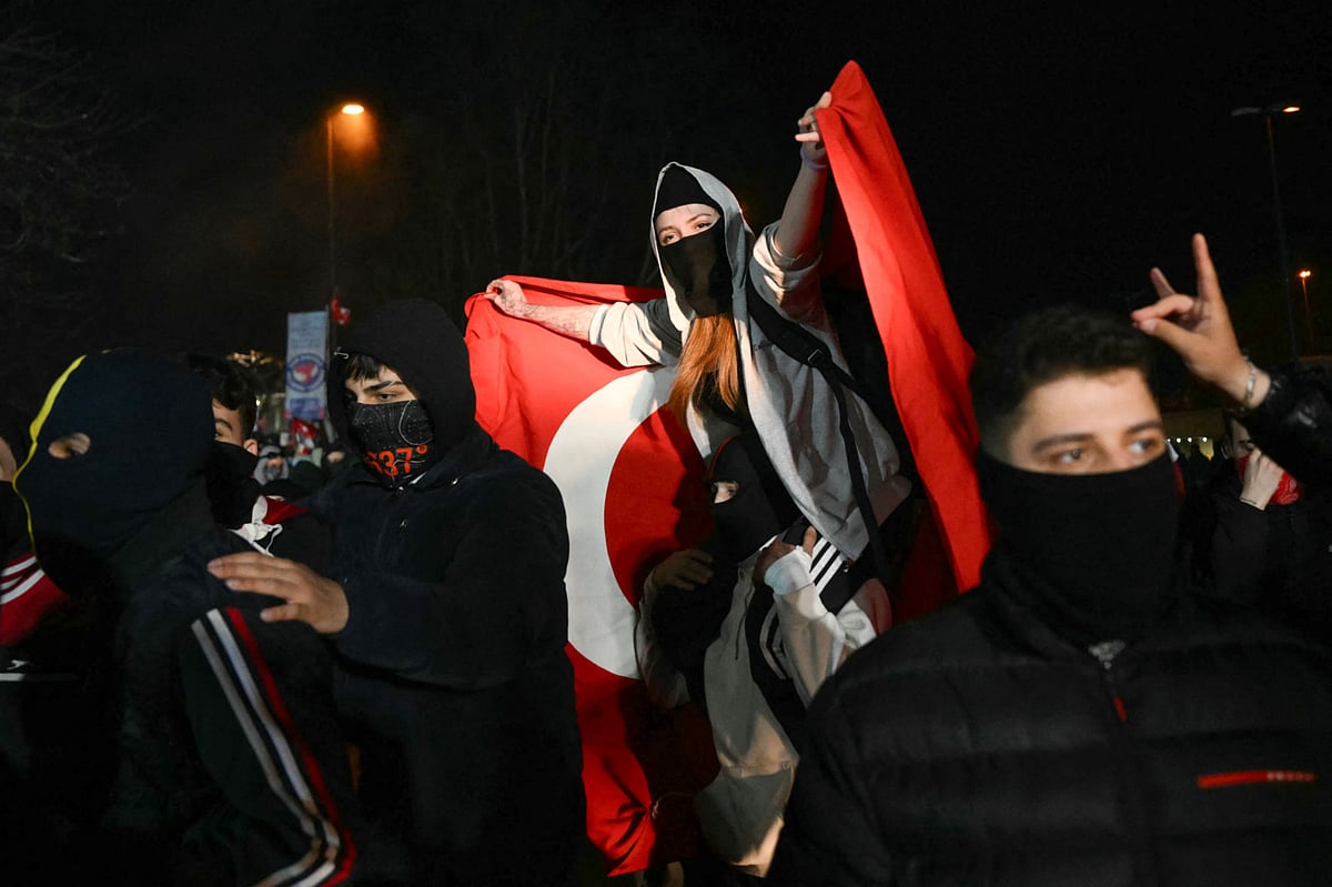 A protester waves a Turkish flag during a rally in support of Istanbul's arrested mayor, in Istanbul, on March 25, 2025. 
