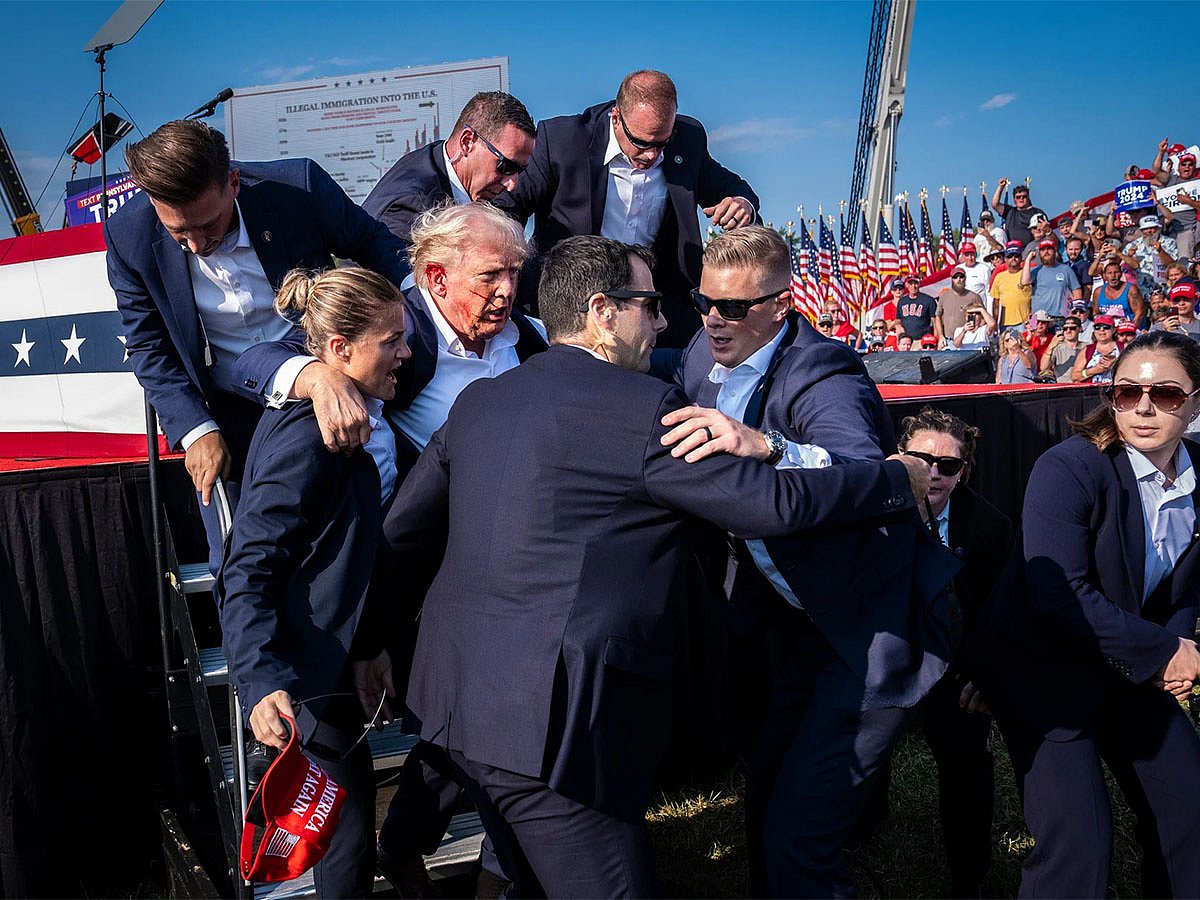 North and Central America – Singles: Members of the US Secret Service help Republican presidential nominee Donald Trump off stage moments after a bullet hit his ear during a campaign rally at the Butler Farm Show Grounds, Pennsylvania, 13 July 2024. The assassination attempt and the media coverage that followed marked a turning point in the presidential campaign that would shape not only the election to come but the political future of the United States.