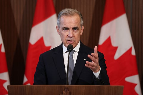 Canada's Prime Minister Mark Carney speaks to the media after meeting with his cabinet to deal with the US auto tariffs on Parliament Hill in Ottawa, Canada, on March 27, 2025