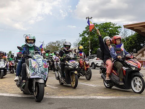 Supporters of former Philippine president Rodrigo Duterte take part in a motorcade rally to celebrate his 80th birthday at Quirino Grandstand in Manila on March 28, 2025.  