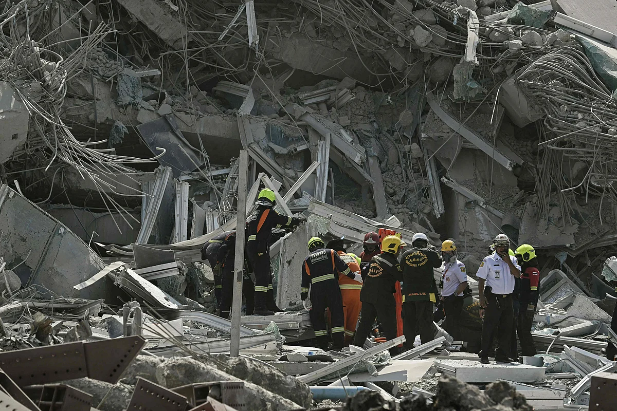 Rescue teams are seen at a construction site where a building collapsed in Bangkok on March 28, 2025, after an earthquake. A powerful earthquake rocked central Myanmar on March 28, buckling roads in the capital Naypyidaw, damaging buildings and forcing people to flee into the streets in neighbouring Thailand.
