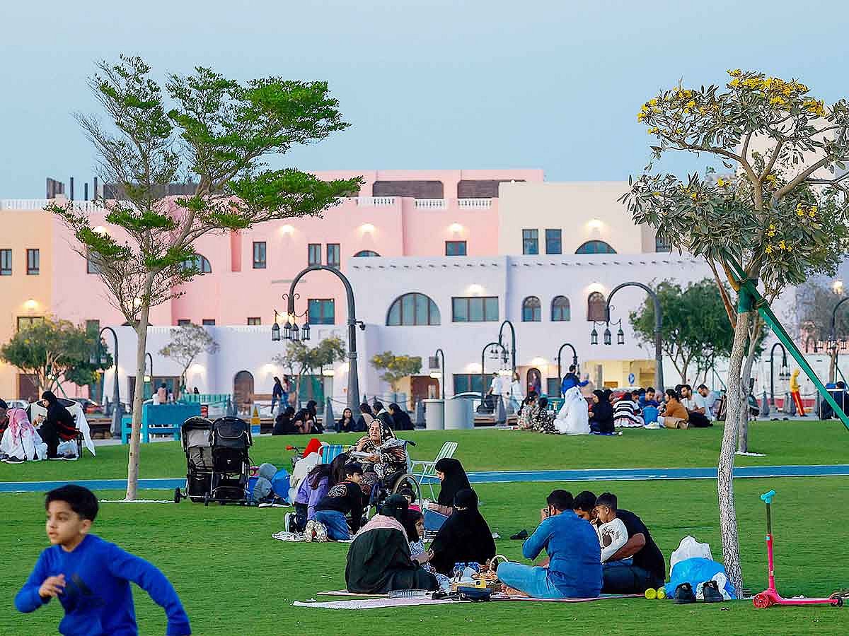 People have their fast-breakig iftar meal during the month of Ramadan at the Old Doha Port on March 28, 2025. 