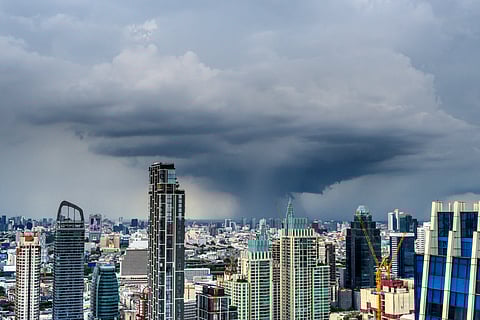 A cumulonimbus cloud is seen over Bangkok's skyline on July 28, 2020.
