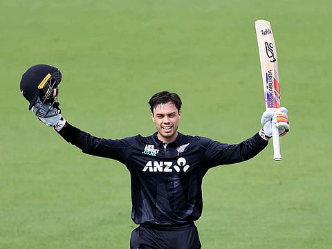 New Zealand's Mark Chapman celebrates 100 runs during the 1st ODI cricket match between New Zealand and Pakistan at McLean Park in Napier on March 29, 2025. 