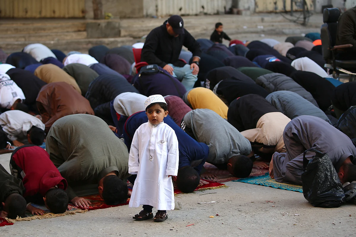 Palestinians attend Eid prayers in the Nuseirat camp for Palestinian refugees in the central Gaza Strip on March 30, 2025.