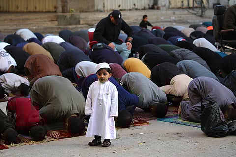 Palestinians attend Eid prayers in the Nuseirat camp for Palestinian refugees in the central Gaza Strip on March 30, 2025.