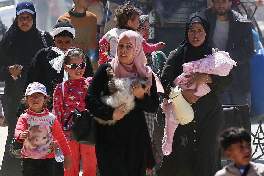 People fleeing Rafah arrive in Khan Yunis city following new Israeli evacuation orders, in the southern Gaza Strip, on March 31, 2025.  