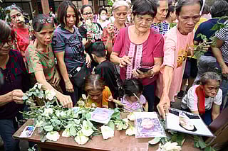 Families of victims of former Philippines president Rodrigo Duterte's "war on drugs" take part in a thanksgiving mass at a church in Manila on March 31, 2025, weeks after Duterte was arrested and brought to the International Criminal Court (ICC) in The Hague.