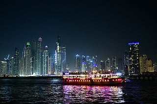 File photo: A boat ferries passengers past the Dubai Marina.