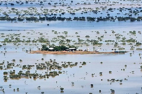 This handout photo taken on March 29, 2025 and released by The Queensland Fire Department shows a homestead under floodwaters near the town of Jundah in south-west Queensland.