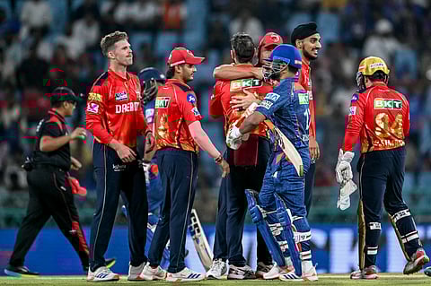 Lucknow Super Giants' captain Rishabh Pant (front) walks back to the pavilion after his dismissal during the Indian Premier League (IPL) Twenty20 cricket match against Punjab Kings at the Ekana Cricket Stadium in Lucknow on April 1.