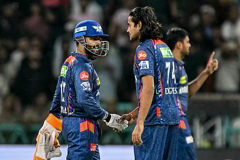 Lucknow Super Giants' Digvesh Rathi (centre) and captain Rishabh Pant (left) have been slapped with fines by the Indian Premier League for various offences.