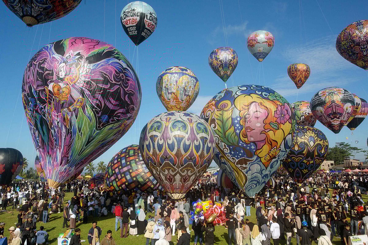 Hot air balloons, mostly made from recycled paper and tied with ropes, float in the air during the annual hot air balloon festival, held since 1950 to celebrate Eid al-Fitr, the Islamic holiday marking the end of Ramadan, in Wonosobo, Central Java, on April 2.