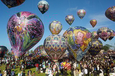 Hot air balloons, mostly made from recycled paper and tied with ropes, float in the air during the annual hot air balloon festival, held since 1950 to celebrate Eid al-Fitr, the Islamic holiday marking the end of Ramadan, in Wonosobo, Central Java, on April 2.