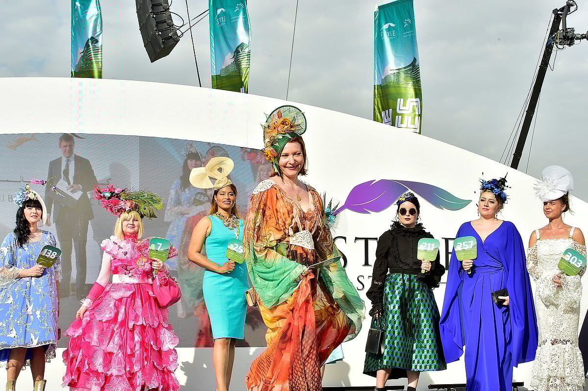 Visitors participate in the prestigious Style Stakes competition during the Dubai World Cup horse racing championships at Meydan, Dubai.