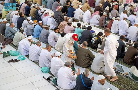 Muslim worshippers break their day-long fast in the Prophet's Mosque in Medina in Ramadan. 