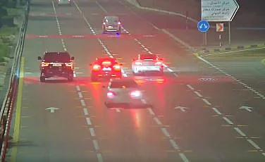 The footage captures a driver recklessly weaving between vehicles at high speed.