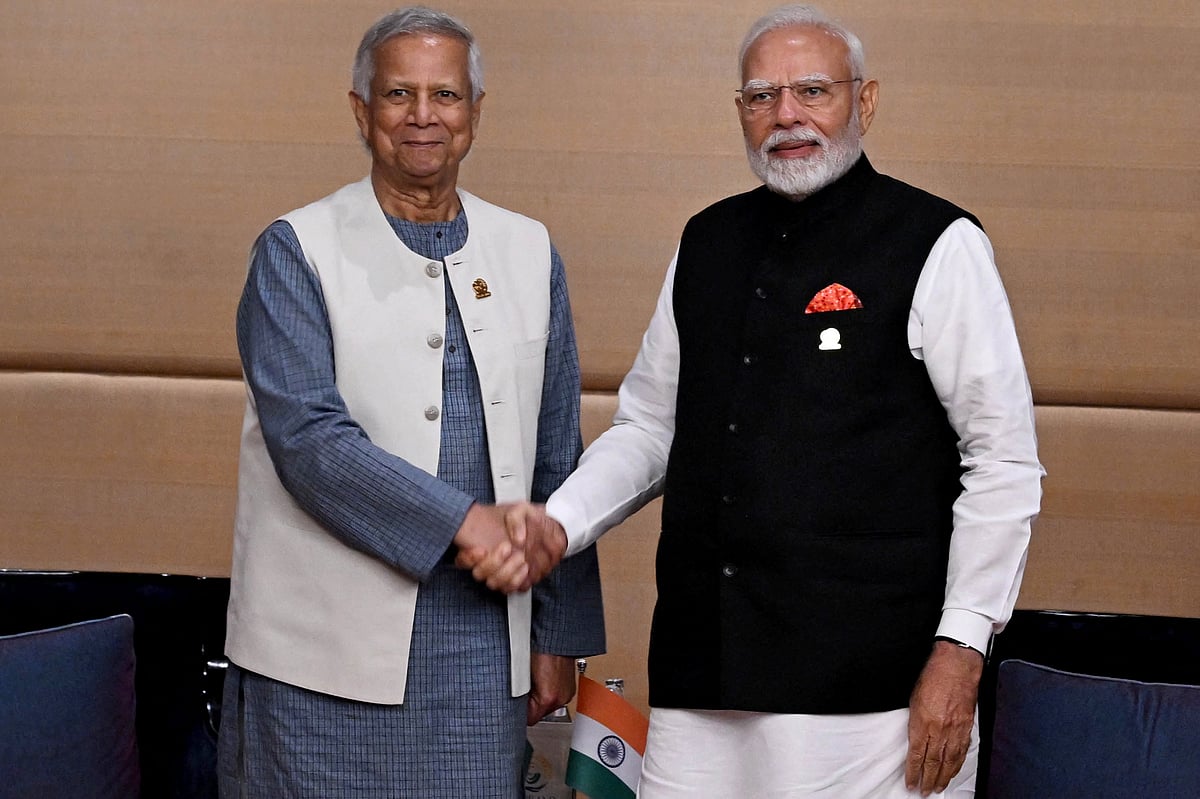In this handout photograph taken and released by Bangladesh's Chief Advisor Office of Interim Government on April 4, 2025, India’s Prime Minister Narendra Modi (R) shakes hands with de facto Bangladeshi leader and Nobel laureate Muhammad Yunus during their bilateral meeting on sidelines of the BIMSTEC Summit in Bangkok, Thailand.
