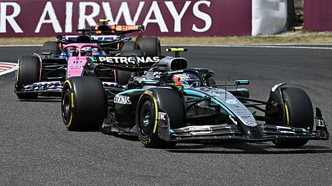 Mercedes' Italian driver Andrea Kimi Antonelli (front), Alpine's French driver Pierre Gasly, and McLaren's British driver Lando Norris (back) drive during the third practice session of the Formula One Japanese Grand Prix at the Suzuka circuit in Suzuka, Mie prefecture on April 5.