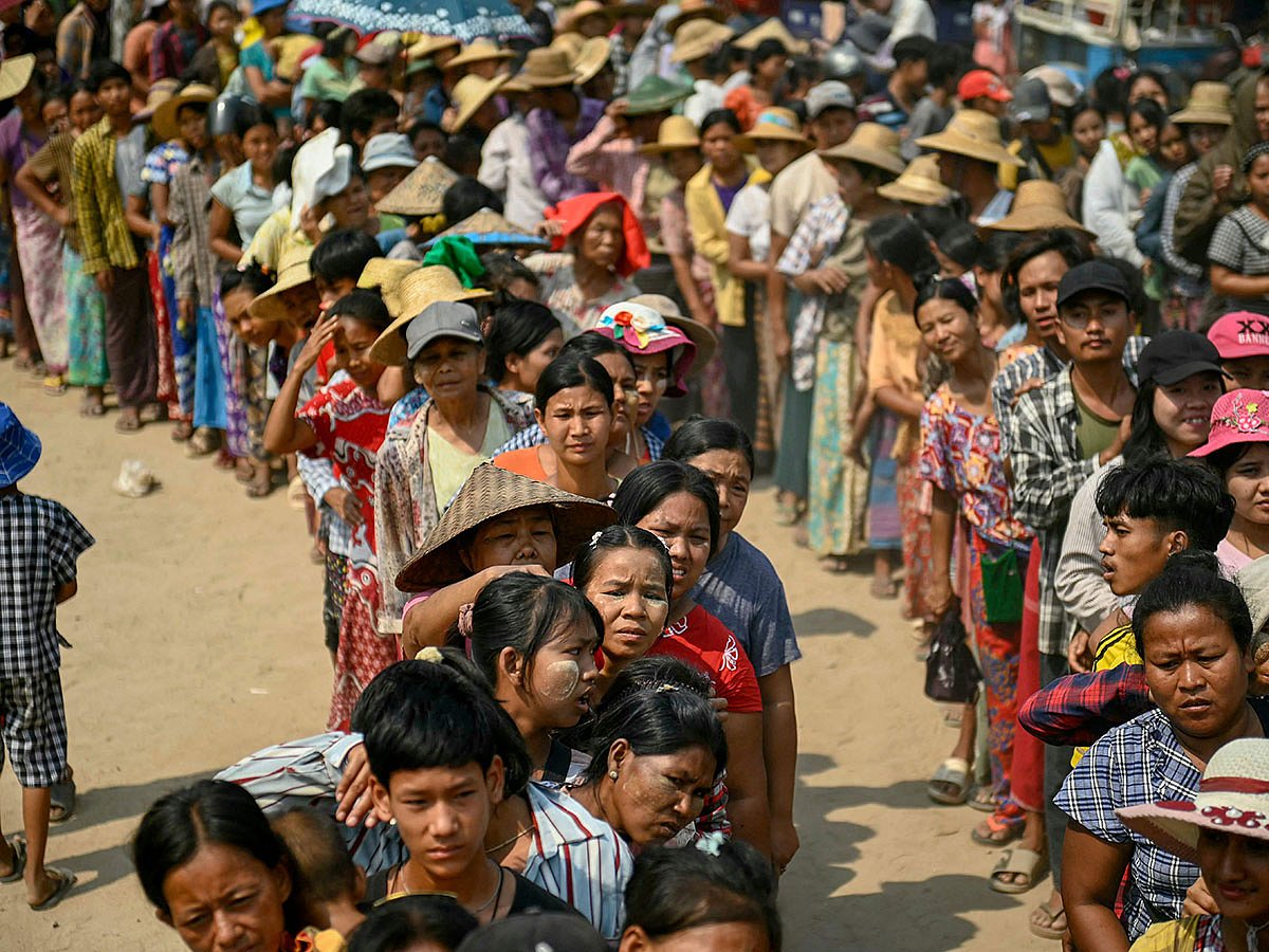 People line up for food aid being distributed in Sagaing following the March 28 earthquake.