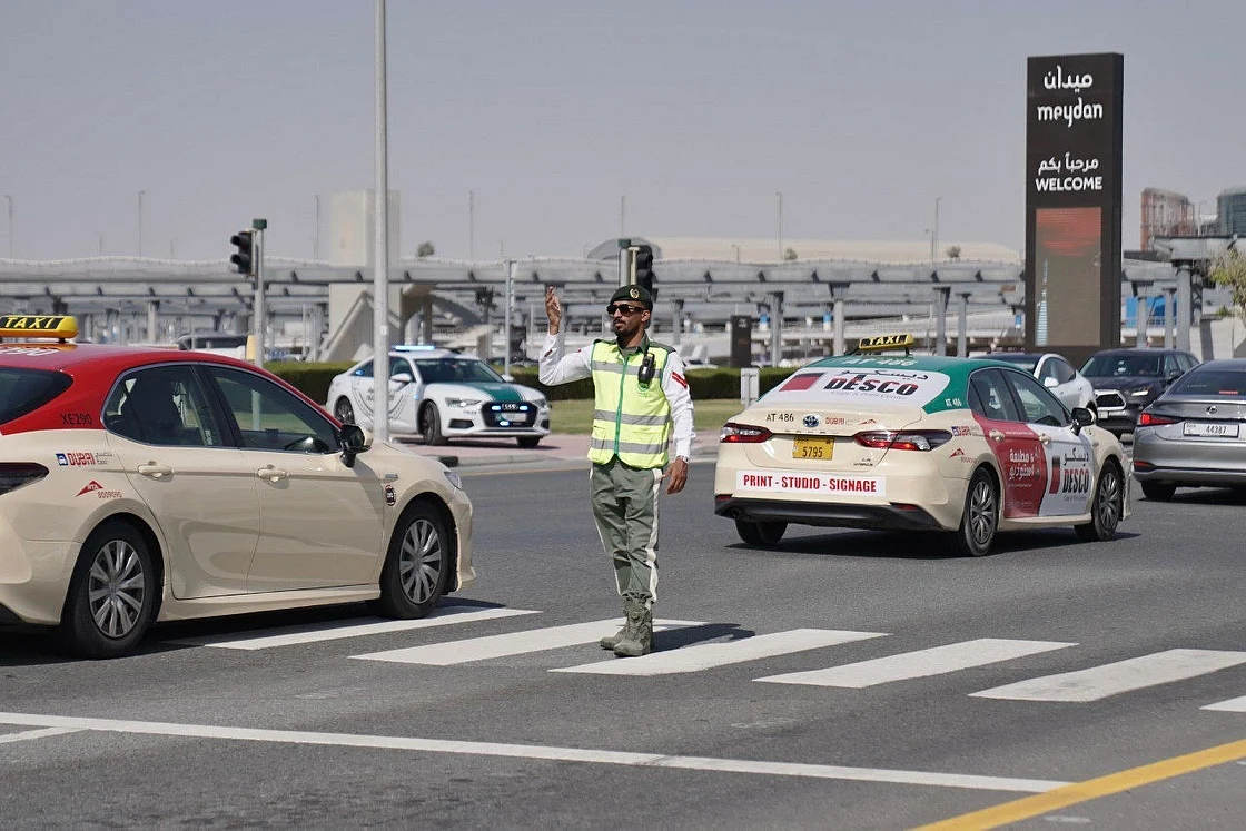 Officers are seen managing crowds, guiding traffic, and monitoring live feeds at the command centre. 