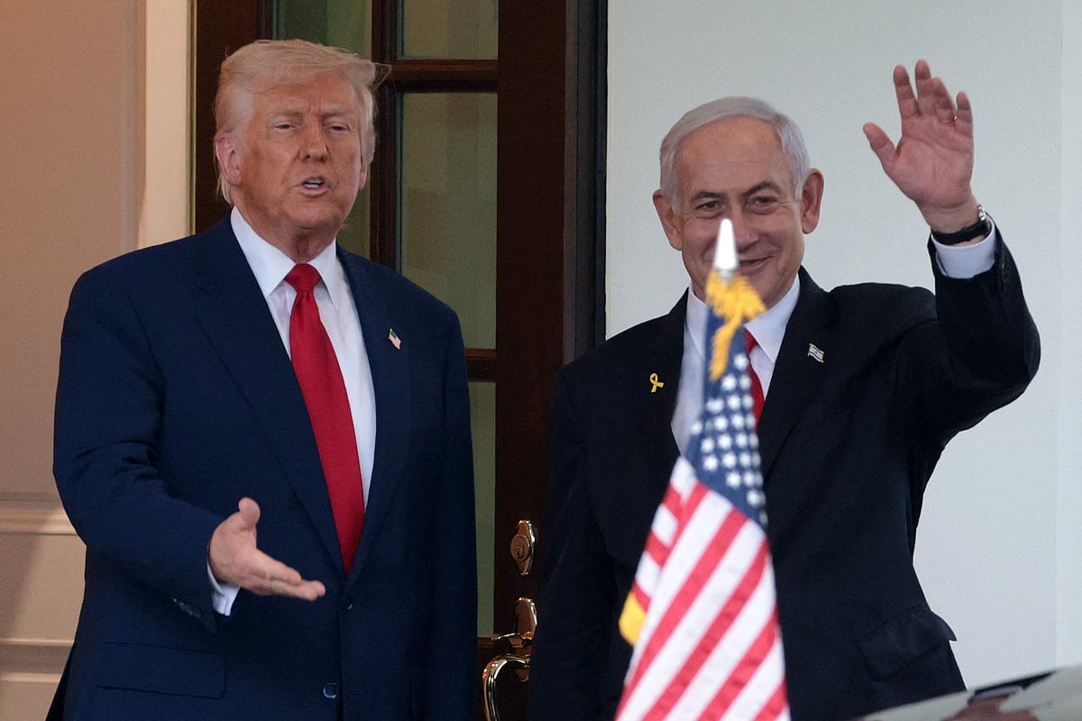 US President Donald Trump (L) bids farewell to Israeli Prime Minister Benjamin Netanyahu (R) as he leaves the White House after a meeting on April 07, 2025 in Washington, DC. 