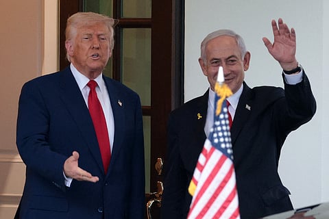 US President Donald Trump (L) bids farewell to Israeli Prime Minister Benjamin Netanyahu (R) as he leaves the White House after a meeting on April 07, 2025 in Washington, DC. 