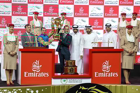Sheikh Hamdan Bin Mohammed Bin Rashid Al Maktoum, Crown Prince of Dubai, Deputy Prime Minister and Minister of Defence of the UAE, and Chairman of The Executive Council of Dubai, presenting trophy to connections of Hit Show after winning the $12 million Dubai World Cup at Meydan on Saturday night.