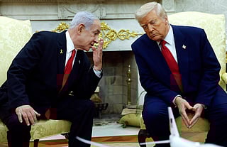 Israeli Prime Minister Benjamin (L) talks to U.S. President Donald Trump during a meeting in the Oval Office of the White House on April 7, 2025 in Washington, DC.