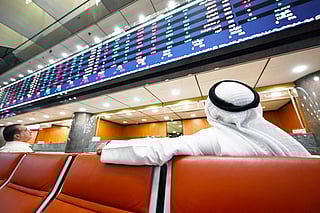 Kuwaiti traders follow the stock market activity at Boursa Kuwait
