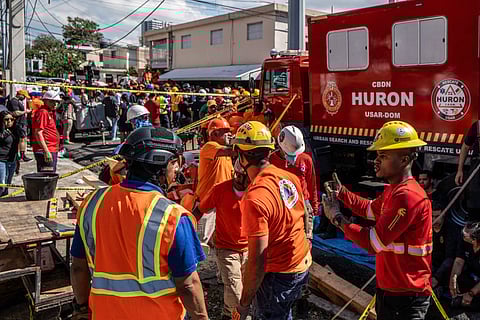 Personnel of Civil Defence and firefighters remove rubble from the Jet Set nightclub following the collapse of its roof, in Santo Domingo.