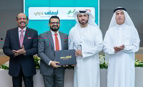 Yussufali M.A and Essa Abdulla Al Ghurair with Salim M.A. and Ali Al Mutawa for the signing of the Lulu-Awqaf Dubai deal.