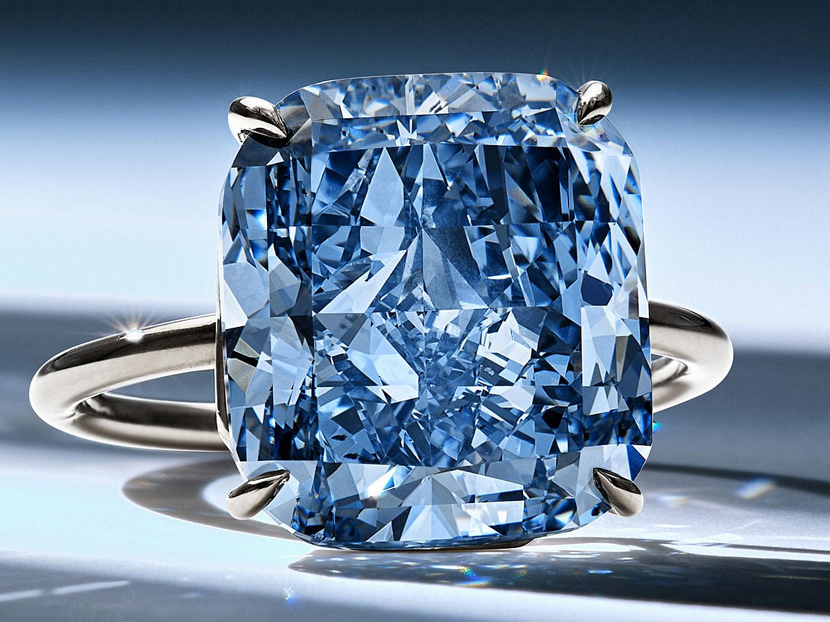 The Mediterranean Blue alongside 'The Golden Canary' and 'The Desert Rose' diamonds. The blue diamond is coming up for auction in Geneva next month.