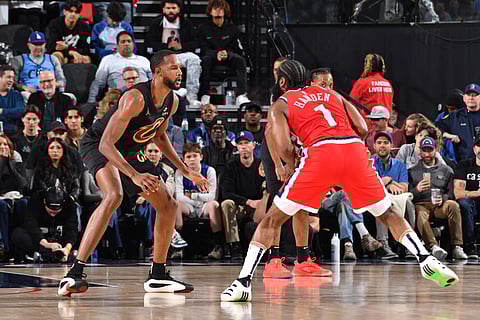 Evan Mobley of the Cleveland Cavaliers plays defense against James Harden of the LA Clippers 