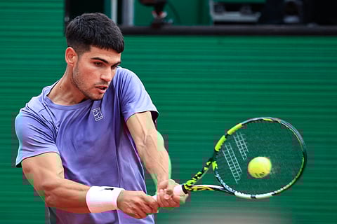 Spain's Carlos Alcaraz plays a backhand return to Argentina's Francisco Cerundolo during the Monte Carlo ATP Masters Series Tournament round of 32 tennis match on the Ranier III court at the Monte Carlo Country Club in Roquebrune-Cap-Martin on April 9.