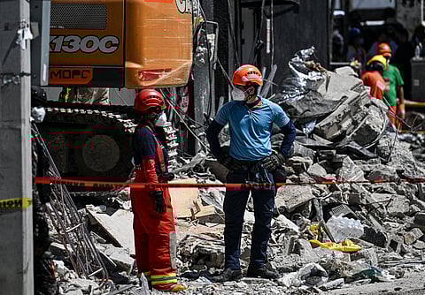 Rescue team member work at the Jet Set nightclub a day after the collapse of its roof in Santo Domingo.