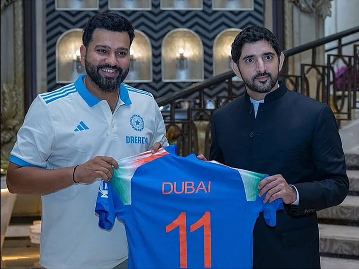 Sheikh Hamdan holds the Team India jersey branded 'Dubai 11' along with Indian skipper Rohit Sharma in Mumbai
