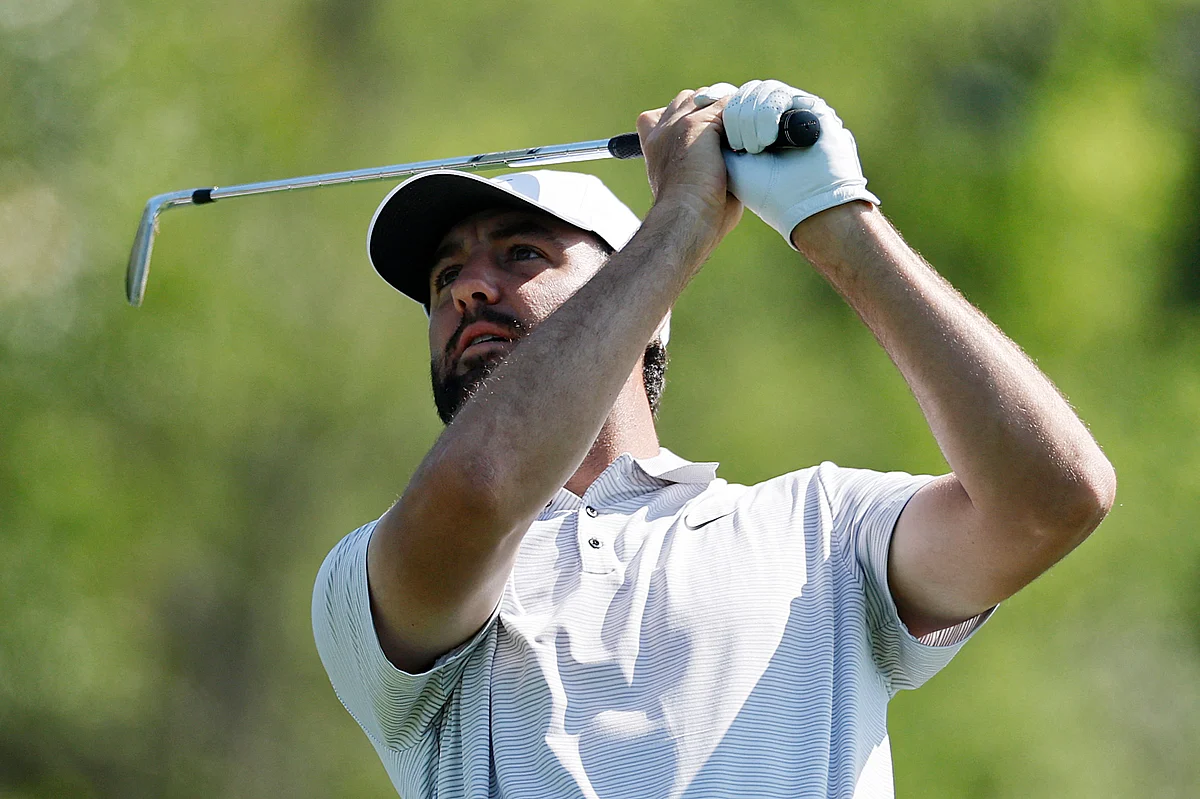Scottie Scheffler of the United States plays his shot from the fourth tee during the first round of the 2025 Masters Tournament at Augusta National Golf Club on April 10 in Augusta, Georgia.