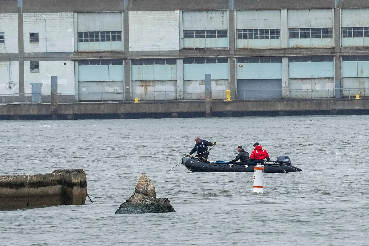 NYPD scuba divers team search next to the site of a crashed helicopter on the Hudson River on April 11, 2025 in Jersey City, New Jersey.
