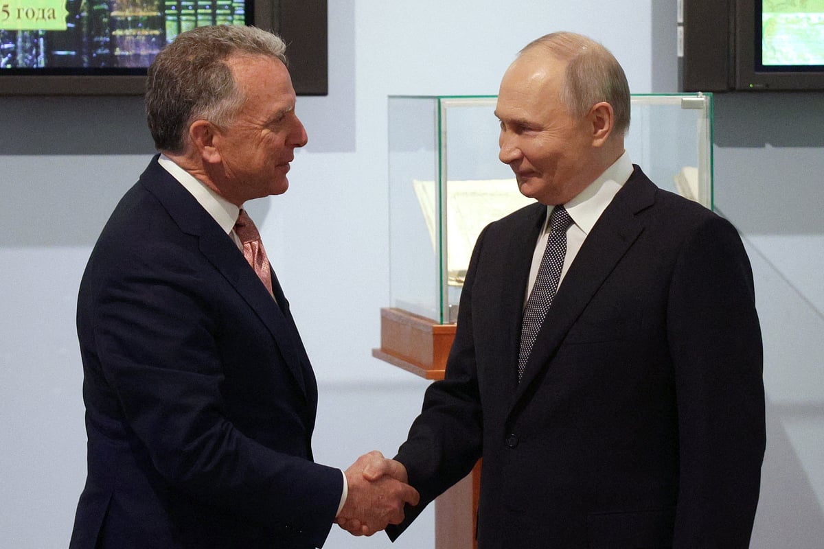 In this pool photograph distributed by the Russian state agency Sputnik, Russia's President Vladimir Putin shakes hands with US President Donald Trump's envoy Steve Witkoff during a meeting in Saint Petersburg on April 11, 2025.
