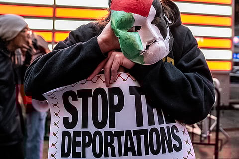 Demonstrators gather in Times Square in solidarity and to demand the release of detained Columbia University graduate student Mahmoud Khalil on April 12, 2025 in New York City.