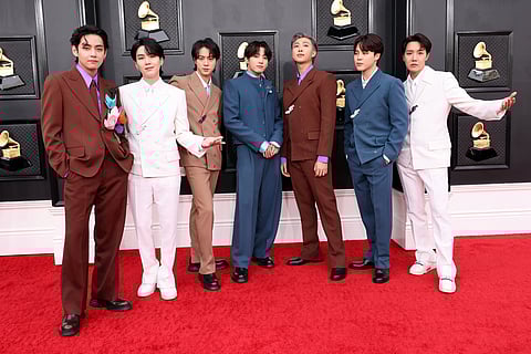 V, Suga, Jin, Jungkook, RM, Jimin and J-Hope of BTS at the 64th Annual GRAMMY Awards at MGM Grand Garden Arena on April 03, 2022 in Las Vegas, Nevada.