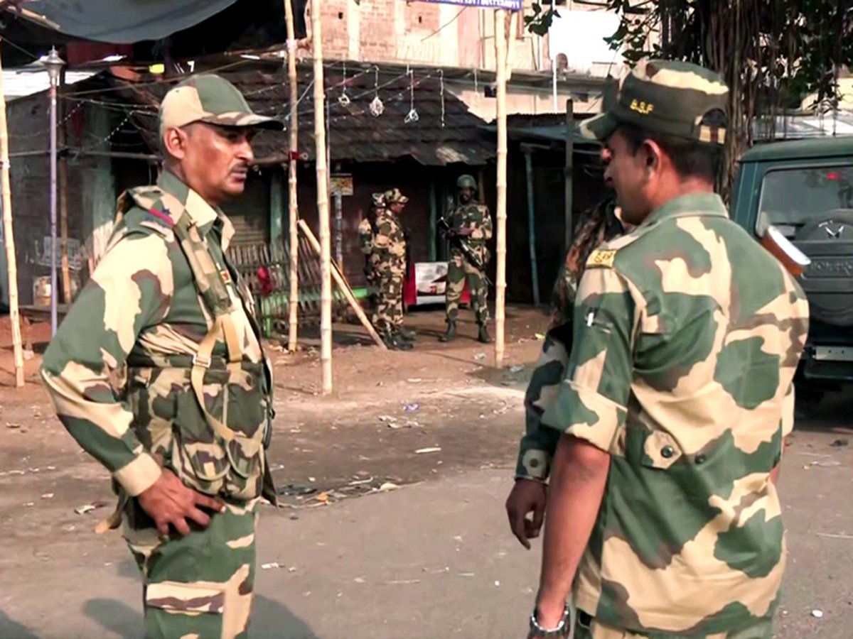 Security personnel stand guard after violent protests against the Waqf (Amendment) Act, at Dhuliyan in Murshidabad on Saturday, April 12, 2025. 