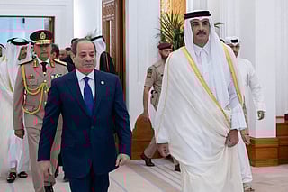 Qatar's emir Sheikh Tamim bin Hamad Al Thani (right) during his meeting with Egypt's President Abdul Fattah Al Sissi in Doha on April 14, 2025. During the visit, Doha announced plans to invest $7.5 billion.