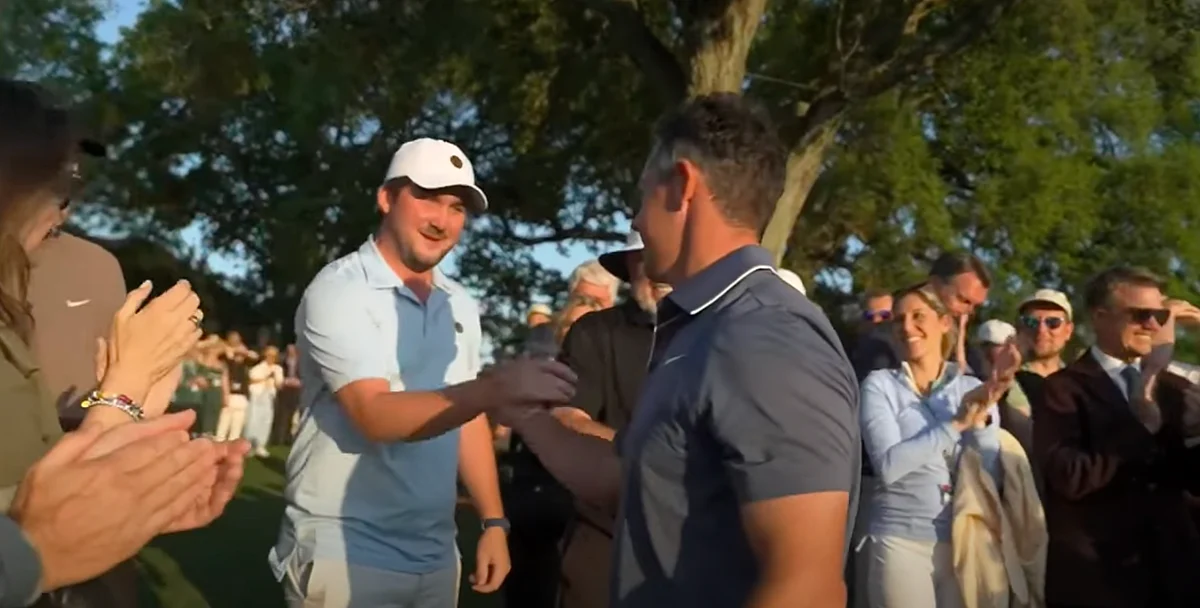 Oscar Craig embraced McIlroy after his triumph