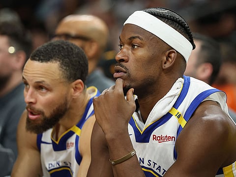 Jimmy Butler III #10 and Stephen Curry #30 of the Golden State Warriors.