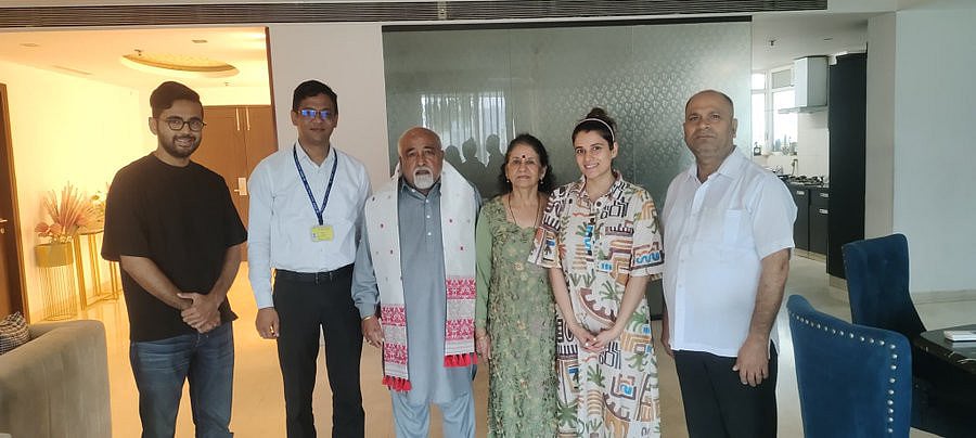 Deepak Kapoor and family members with an Assamese Gamocha – a handwoven cloth and a recognisable symbol of Assamese identity and culture.