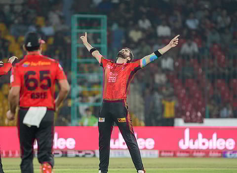 Left-arm pacer Shaheen Shah Afridi brings out his trademark celebration after dismissing Karachi Kings' opener David Warner in their Pakistan Super League match on Tuesday.